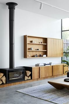 a modern living room with wood burning stove