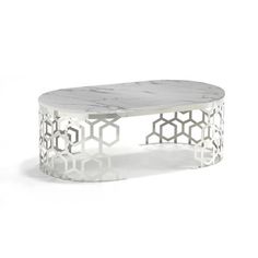 a marble and metal coffee table with hexagonal design on the top, against a white background