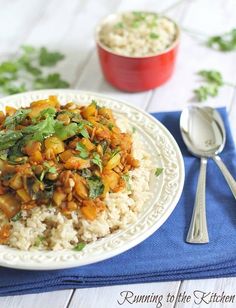 a white plate topped with rice and vegetables