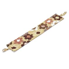 High-quality Japanese glass seed beads. Freshwater 8mm pearls. 14k gold filled clasps & 1" extender chains. Flat woven band is 1-1/8"w. Great solo or stacked. Bracelet Size Guide Elegant Brown Metal Beaded Bracelets, Adjustable Brown Beaded Chain Bracelet, Flower Bead Bracelet, Daisy Chain Bracelet, Bead Cuff Bracelet, Mocha Color, Daisy Chain, Flower Bracelet, Coffee Set