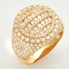 a gold and diamond ring on a white surface with the center surrounded by smaller diamonds