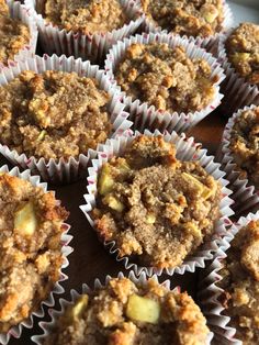 muffins with crumbled toppings sitting on a table