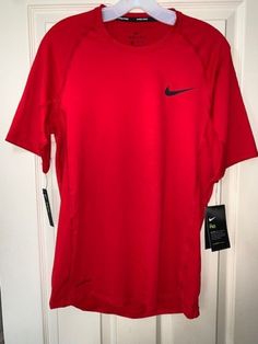 Red Crew Neck Sports Top, Red Crew Neck Top For Sports, Nike Fitted T-shirt For Sports, Nike Fitted Tops For Sports Events, Red Nike Running Activewear, Red Nike Activewear For Running, Fitted Nike Tops For Sports Events, Red Athleisure T-shirt For Sports Season, Dri-fit Short Sleeve Tops For Sports Season