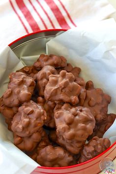 chocolate covered cookies are in a red bowl