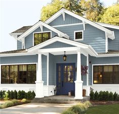 the front view of a gray house with white trim