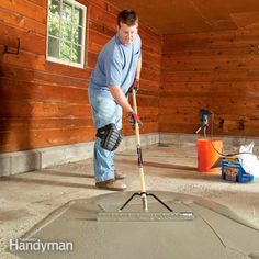 a man is using a mop to clean the floor