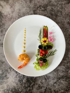 a white plate topped with different types of food on top of a gray countertop