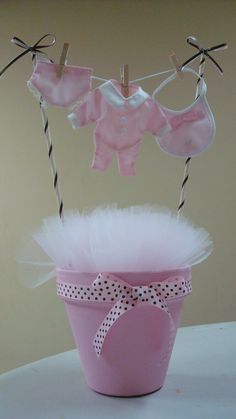 a pink bucket with some clothes hanging from it