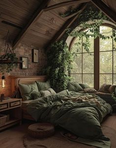 a large bed sitting under a window in a bedroom