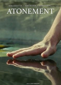 a person's hand reaching for something on top of a table with the words atonement above it