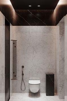 a modern bathroom with marble walls and flooring