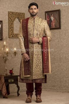 Pakistani Gold Sherwani for Groom with Red Shawl in Stylish design embellished with stone, zari embroidery with resham and zardosi work. This ethnic sherwani is best choice for groom. Sherwani: The dressing of groom should be exceptional on wedding day the gold colored wedding sherwani has the thread embroidery overall the surface of the sherwani. It embellished with zardosi, beads, zari embroidery. This sherwani which gives good look with trendy touch. This is the perfect outfit who want to hav Indian Men Wedding Outfit Groom Attire, Gurdwara Wedding, Sangeet Ideas, Groom Indian Wedding Outfits, Gold Sherwani, Light Knight, Indo Western Outfits For Men, Grooms Outfit, Sherwani For Groom