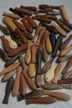 many different types of wooden spoons on a table