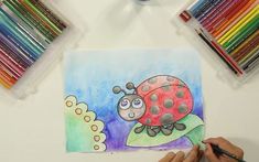 a ladybug drawing on paper with colored pencils