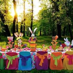 an image of a table set up with bunny decorations and bunnies for easter dinner