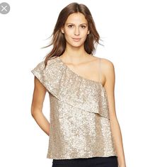 Absolutely Dazzle In This Sequined One Shoulder Blouse, Which Features A Ruffle Popover For An Added Feminine Touch. Details: One Shoulder Flutter Sleeve Adjustable Spaghetti Strap Ruffle Popover On Bust Sequined Solid Color Fiber Content: 96% Rayon, 4% Spandex Feminine Sequin Tops For Spring, Rose Gold Blouse, Blouse One Shoulder, Off Shoulder Ruffle Top, Ditsy Floral Top, Cutout Blouse, Sequin Blouse, Gold Blouse, Womens Sleeveless Tops