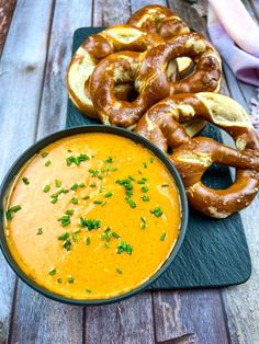 some pretzels and a bowl of soup on a table