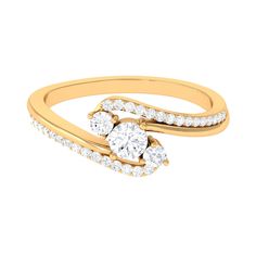 a gold ring with two diamonds on the side and an oval shaped diamond in the middle