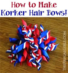 a bunch of red, white and blue hair bows sitting on top of a wooden table