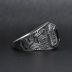 The United States Military Black Stone Women's Army Ring from our Military Collection is custom molded and cast with a premium blend of surgical stainless steel that offers enhanced durability, even after exhaustive wear. The woman's style of the United States Military Black Stone Army Ring is smaller than the men's version but also features a dark black stone centerpiece with detailed sides and "United States Army". This ring is a bulkier-styled ring that is great for women and men who want a c Durable Silver Promise Ring, Black Stainless Steel Engraved Ring, Tarnish Resistant Silver Stainless Steel Rings, Durable Silver Metal Ring, Classic Silver Titanium Rings, Classic Durable Silver Jewelry, Black Titanium Jewelry With Polished Finish, Durable Classic Stainless Steel Jewelry, Army Rings