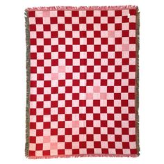 a red and white checkered rug with fringes on the edges, against a white background