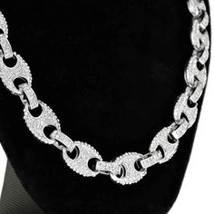 Men's Mariner blinged out chain necklace. Measures 20 inches long x 12mm wide. Encrusted with round-cut bling stones. High quality silver tone over base metal. Chain has some weight to it at 100 grams. Stylish box clasp to lock your anchor chain. Enjoy 100% FREE SHIPPING in the USA. Customer Reviews Silver Rhinestone Cuban Link Necklace, Silver Cuban Link Necklace With Rhinestones, Silver Cuban Link Chain Necklace With Rhinestones, Silver Cubic Zirconia Iced Out Chain Necklace, Bling Crystal Chain Link Necklace, Sparkly Crystal Chain Link Necklace, Silver Chunky Chain Jewelry With Cubic Zirconia, Silver Jewelry With Chunky Chain And Cubic Zirconia, Silver Jewelry With Chunky Chain In Cubic Zirconia