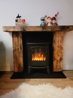 a wood burning fireplace in a living room next to a white sheepskin area rug