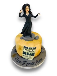 a birthday cake with a woman on top