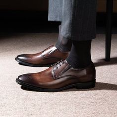 Introducing our exquisite Refined Cow Leather Brogue Dress Shoes, meticulously crafted with genuine cow leather for a durable and luxurious feel. The refined upper material and genuine leather lining add a touch of opulence, while the lace-up closure and high-quality pigskin insole ensure comfort and support. Elevate your ensemble and exude confidence with every step by investing in these timeless and impeccably crafted shoes. Experience the perfect blend of style, comfort, and durability with o Elegant Goodyear Welted Lace-up Derby Shoes, Elegant Brown Derby Shoes With Brogue Detailing, Elegant Goodyear Welted Lace-up Derby, Elegant Brown Derby With Brogue Detailing, Elegant Brown Wingtip Oxfords, Elegant Brown Wingtip Derby Shoes, Elegant Brown Derby Shoes With Almond Toe, Elegant Brown Derby With Almond Toe, Elegant Brown Almond Toe Derby Shoes