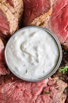 sliced steak with ranch dressing in a bowl