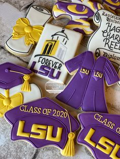 decorated cookies with purple and yellow graduation decorations