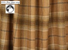 a brown and tan plaid curtain with a white label on it that says, 100 % fine linen yarns