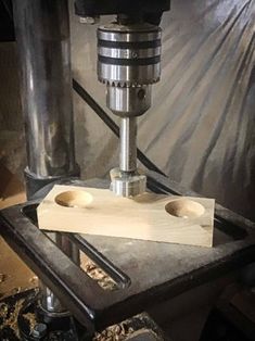 a milling machine with two holes in it