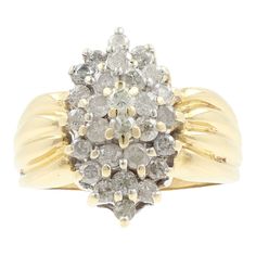 a diamond cluster ring set in yellow gold