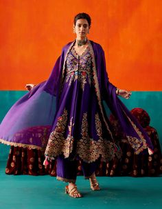 Indulge in luxury with this purple anarkali set, showcasing intricate floral embroidery highlighted by various embellishments for a touch of opulence. Paired harmoniously with pants and an embroidered dupatta, this ensemble radiates sophistication and timeless charm, perfect for special occasions. Semi-stitched Purple Georgette Palazzo Set, Purple Georgette Palazzo Set With Straight Kurta, Semi-stitched Purple Sharara With Resham Embroidery, Purple Palazzo Set With Zari Work For Navratri, Embroidered Floor-length Purple Churidar, Embroidered Purple Floor-length Churidar, Purple Palazzo Set With Dabka Work And Straight Kurta, Unstitched Purple Palazzo Set For Navratri, Bollywood Style Embroidered Purple Salwar Kameez