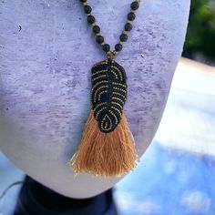 Stunning and unique hand beaded vintage artisan black and gold tassel necklace. The beaded necklace measures 32" all the way around (hangs down 16").   The beadwork and gold silky tassel measures 4" Unsigned, unknown artist.  Wonderful condition. Unique vintage handmade necklace. Thanks for looking! Gold Tassel Necklace, Textile Jewelry, Handmade Necklace, Hand Beading, Black And Gold, Handmade Necklaces, Unique Vintage, Tassel Necklace, Bead Work