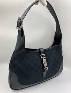 A stunning vintage Gucci Jackie bag made from black canvas with black leather trim and silver hardware. This bag also has the iconic Gucci pin lock closure. Inside the bag is lined with the black Gucci nylon lining and there is a zipped pocket for valuables. This bag is in exceptional vintage condition, a true collectors item and comes with its original Gucci dust bag. Vintage Gucci Jackie, Pin Lock, Diaper Backpack, Vuitton Bag, Black Canvas, Casual Backpack, Baby Bag, Handbag Backpack, Kids Bags