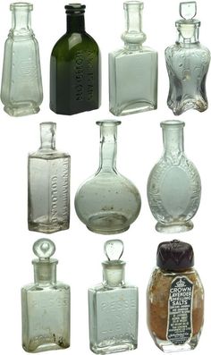 an assortment of glass bottles with labels on them