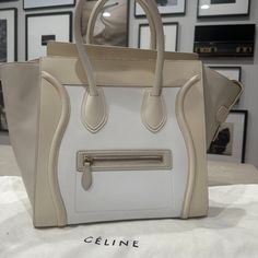 Quintessential Classic Celine Paris Mini Luggage Bag In A Neutral 3 Tone. Beautiful And In Excellent Condition! About The Luggage Tote: After Phoebe Philo Re-Launched The Silhouette In 2010 (With Some Minor Tweaks) The Bag Was Immediately Coveted By All. Now Available In A Multitude Of Sizes, Colors, And Materials The Bag Became Even More Of A Collector's Piece, With Cline Fans Chasing Down The Latest Iterations Of The Bag Every Season White & Cream/Tan Leather Gold-Tone Hardware Rolled Handles High-end White Rectangular Bag, High-end White Double Handle Bag, High-end White Rectangular Shoulder Bag, High-end Cream Leather Bag, High-end White Bag For Daily Use, High-end White Shoulder Bag For Travel, High-end White Shoulder Bag For Shopping, High-end Cream Travel Bag, Designer White Leather Shoulder Bag