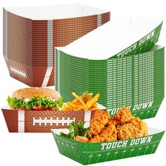 two boxes with different foods in them, one has a football and the other has french fries