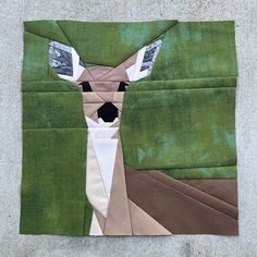 a piece of fabric with a deer on it