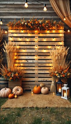 an outdoor fall wedding with pumpkins and flowers on the side of a wooden fence