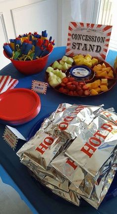 a blue table topped with lots of food