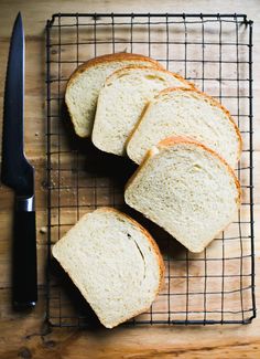 slices of white bread sitting on top of a wire rack