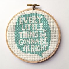 there is a cross stitch pattern in the hoop with words that read, every little thing is going to be alright