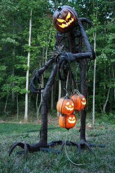 an image of a halloween decoration made out of branches and jack - o'- lanterns