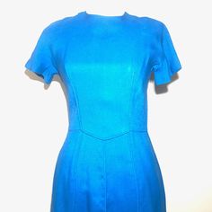 "Vintage 1950's Lanz Press - Lanz Originals Cobalt Blue Sheath Dress > Size 13 > Button up back > Short Sleeve CONDITION: In amazing condition. No noted Flaws MEASUREMENTS: Bust - 30\" Waist - 14\" Length - 41\" Underarm to Underarm - 15\" ** Note - All of the inventory in the store are used Vintage items, outside of the homemade beadwork. Please check out the pictures provided and read the description accordingly, as most of the items have some amount of wear from age. I will do my abs Solid Color Fitted Knee-length Vintage Dress, Fitted Vintage Dress In Solid Color, Fitted Vintage Short Sleeve Dress For Work, Fitted Vintage Dress With Short Sleeves For Work, Fitted Short Sleeve Vintage Dress For Work, Fitted A-line Blue Vintage Dress, Vintage Blue A-line Dress, Blue Fitted Vintage Dress With Short Sleeves, Blue Retro Dress With Fitted Bodice