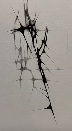 a drawing of a tree branch in black and white ink on paper with watermarks