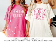 two women wearing matching t - shirts with the words dancing queen and honey honey on them