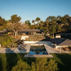 an aerial view of a house and its pool